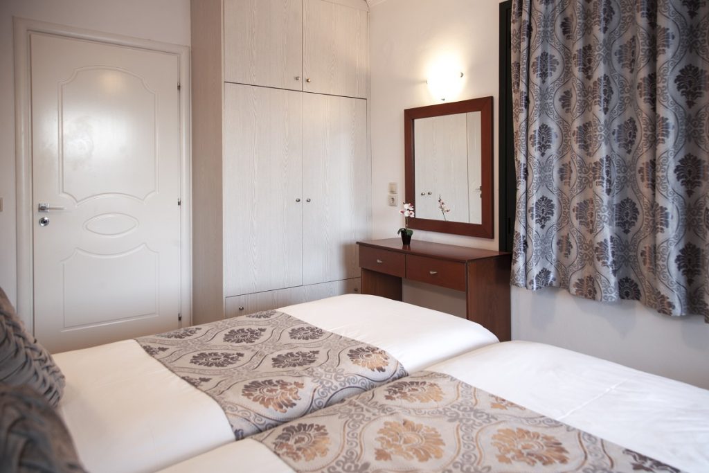 ethereal deluxe apartment nidri lefkada bedroom pillow bed courtain mirror closet door